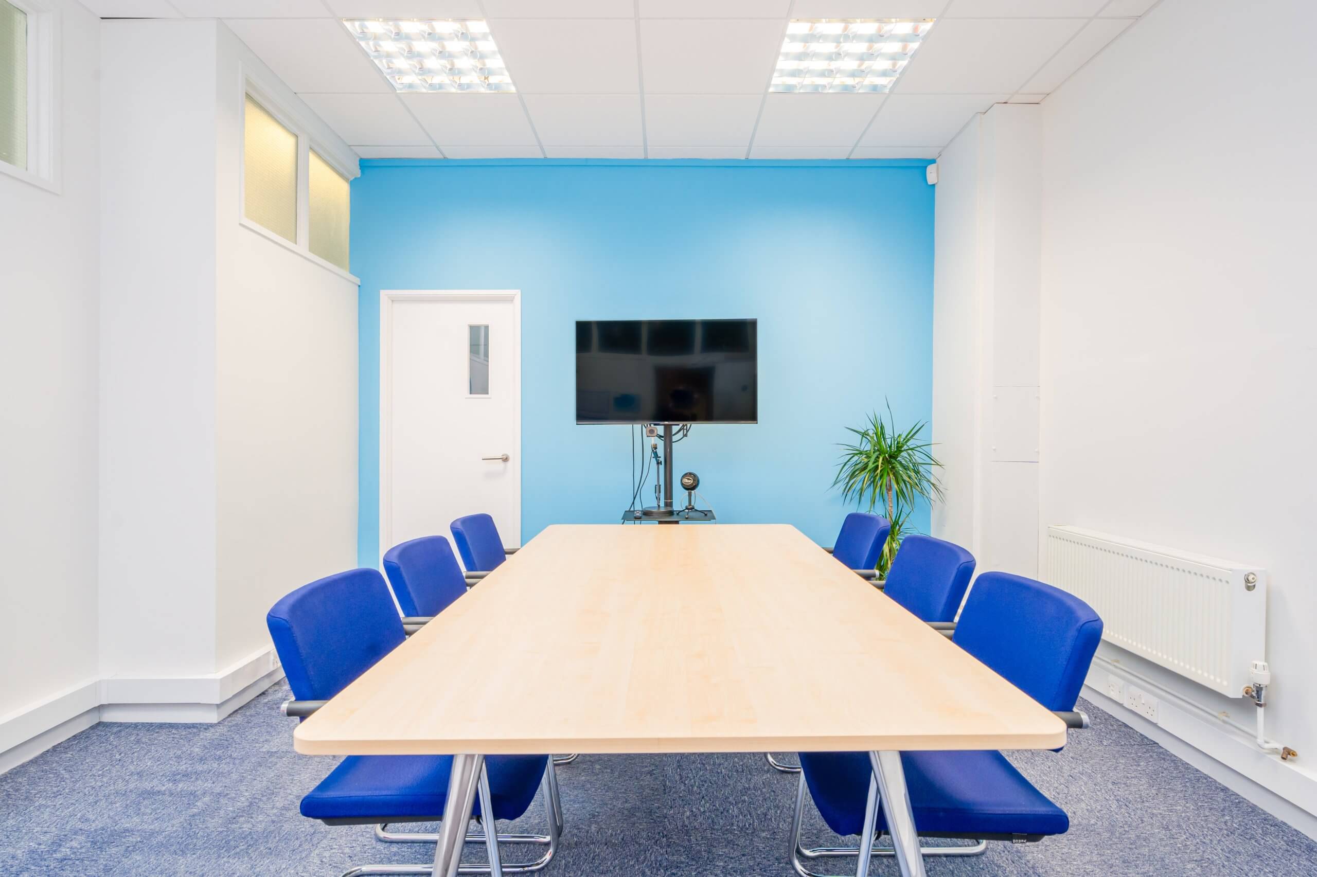 Six person Meeting Room with a large screen for presenting on